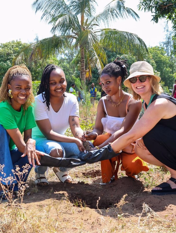 Girls planting tree